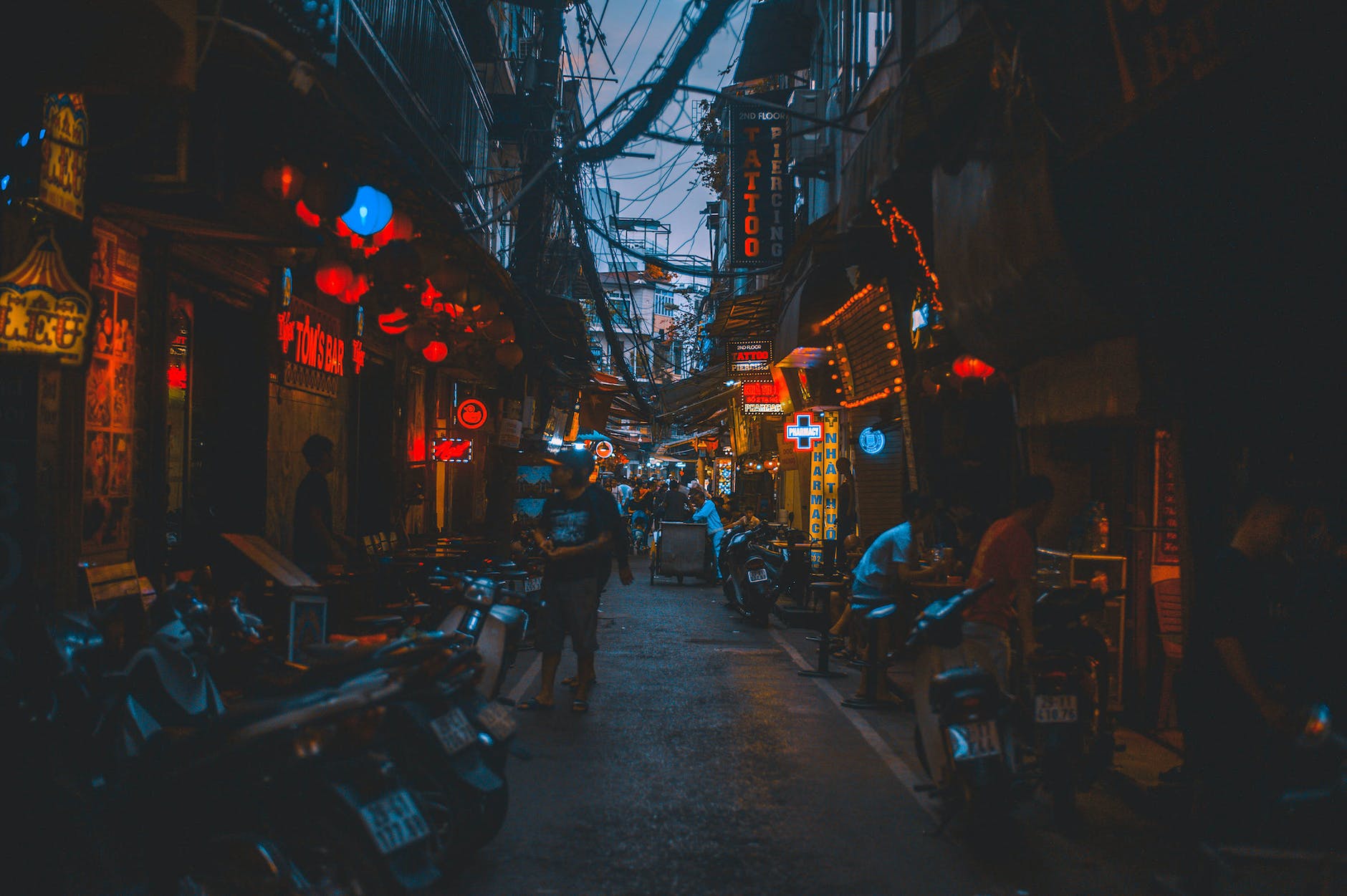 people along narrow alley