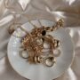 golden accessories on white saucer