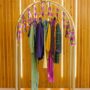 colorful fringe hanging on a clothes rack