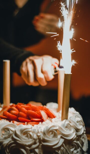 person lighting the sparklers