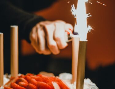 person lighting the sparklers