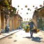 unrecognizable ethnic woman with baskets of flowers strolling on street in vietnam