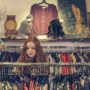 photo of woman near clothes