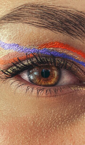 eye of crop woman with colorful makeup